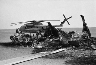 The burned wreckage of a US Navy RH-53D Sea Stallion in the Iranian desert after the disastrous Operation Eagle Claw. The failed rescue mission made clear the need for a high-speed, long-range, V/STOL aircraft. (IR-PSRI)